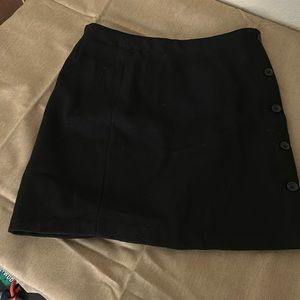 Banana Republic black knee length skirt, side button closures. Vintage.
